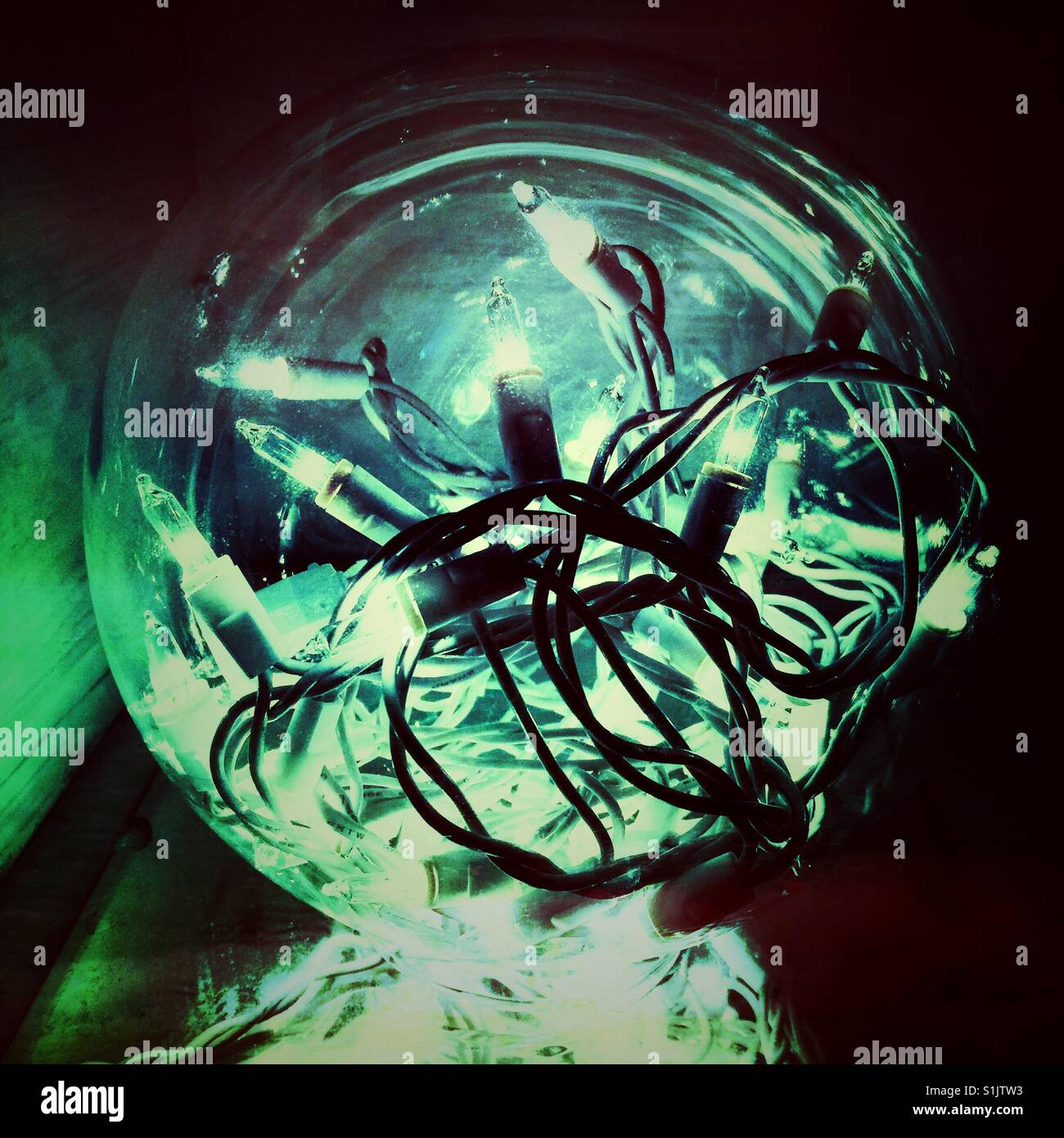 Christmas lights in glass sphere in green hue - Smartphone Captured Stock Image