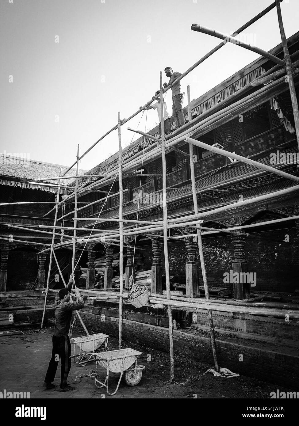 Restoring historic building on Durbar Square in Bhaktapur Stock Photo