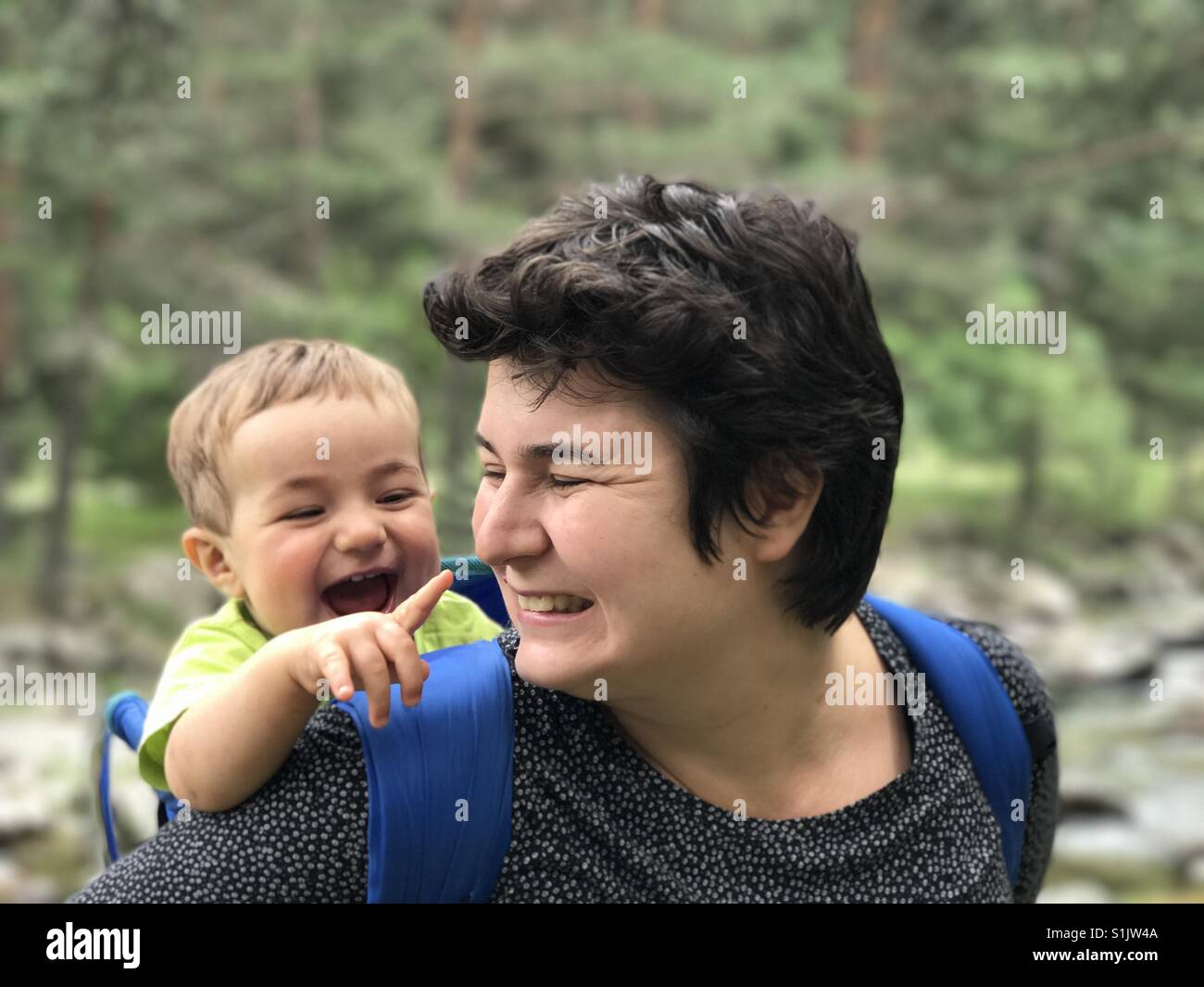 Mother and child hiking in the mountains - Smartphone Captured Stock Image