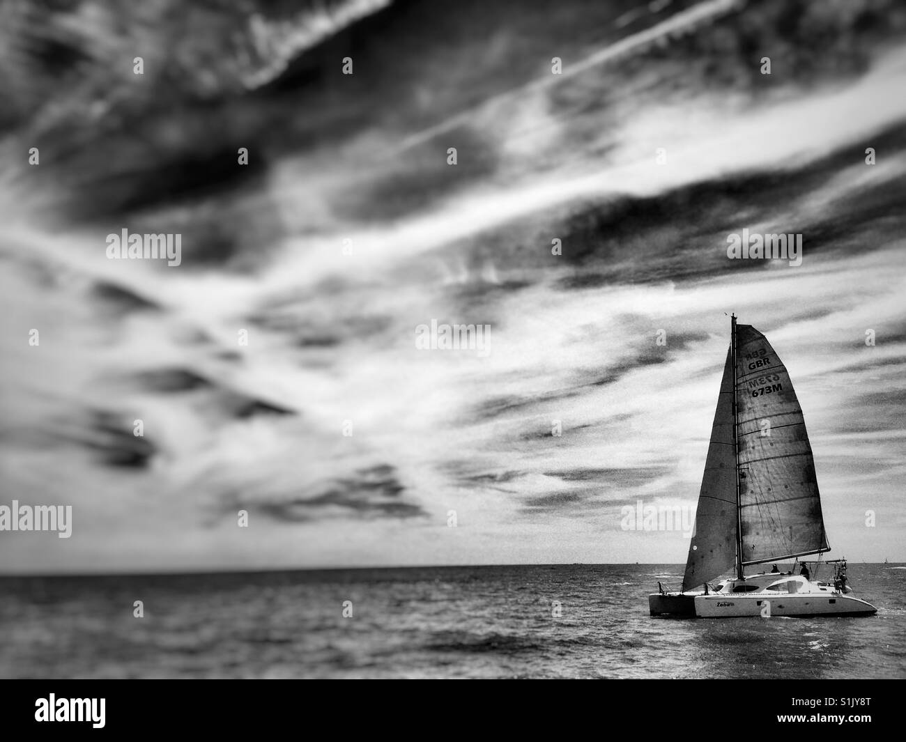 Catamaran entering the river Ore estuary, Shingle Street, Suffolk, England. - Smartphone Captured Stock Image