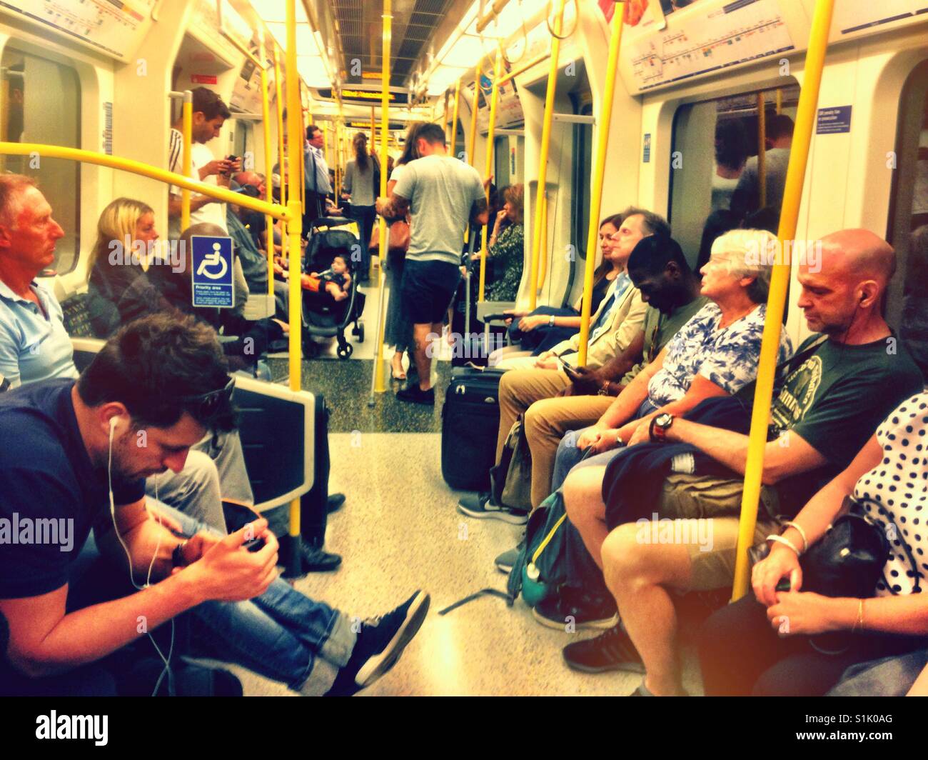 Sitting onboard a Circle Line train on The London Underground. - Smartphone Captured Stock Image