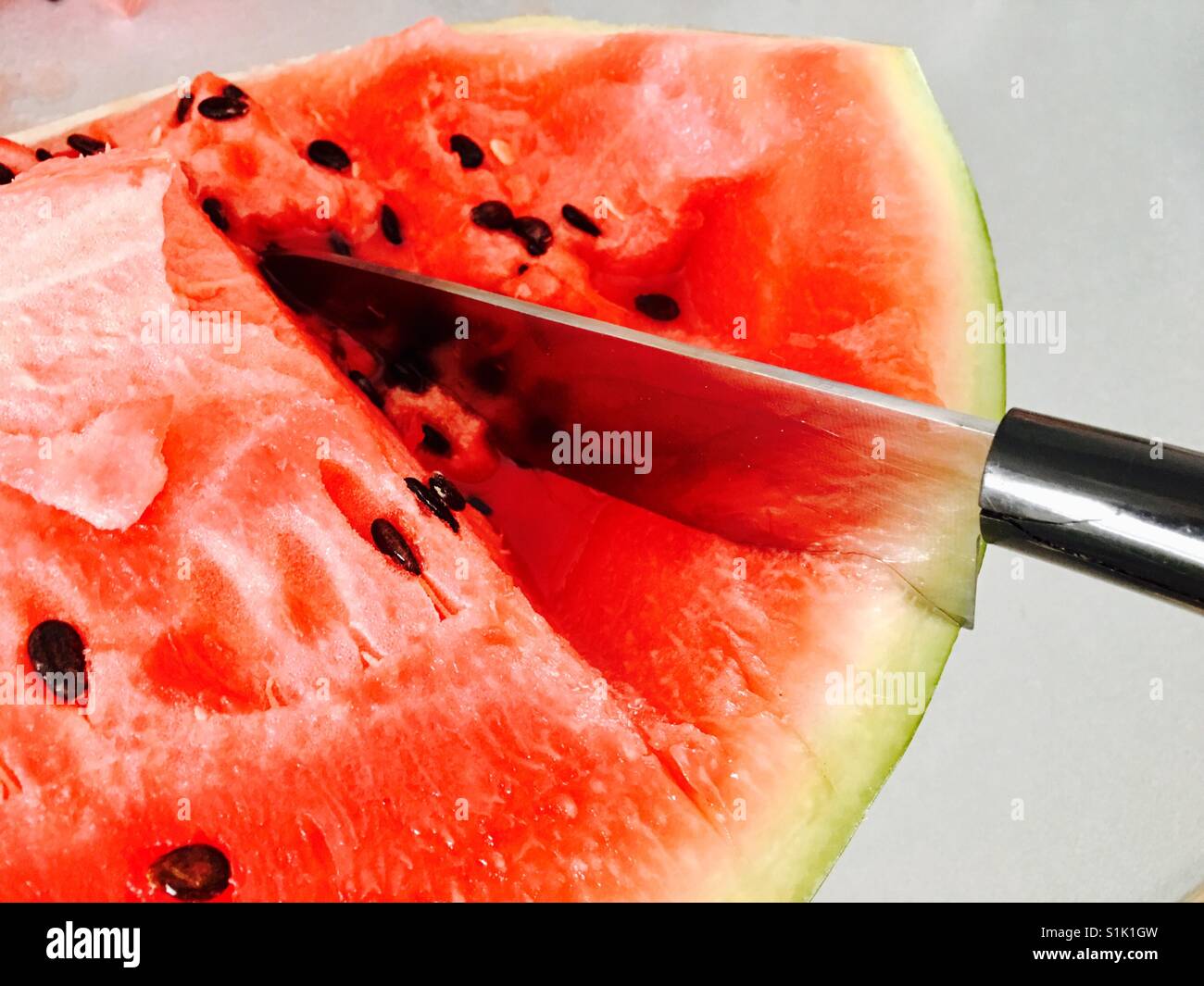 Knife in watermelon Stock Photo