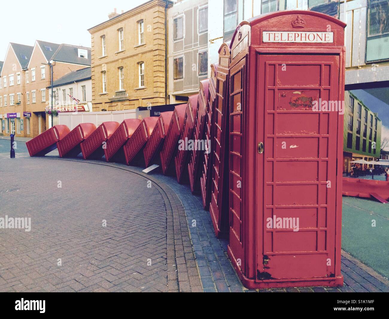 A row of red telephone boxes in Kingston town centre Stock Photo