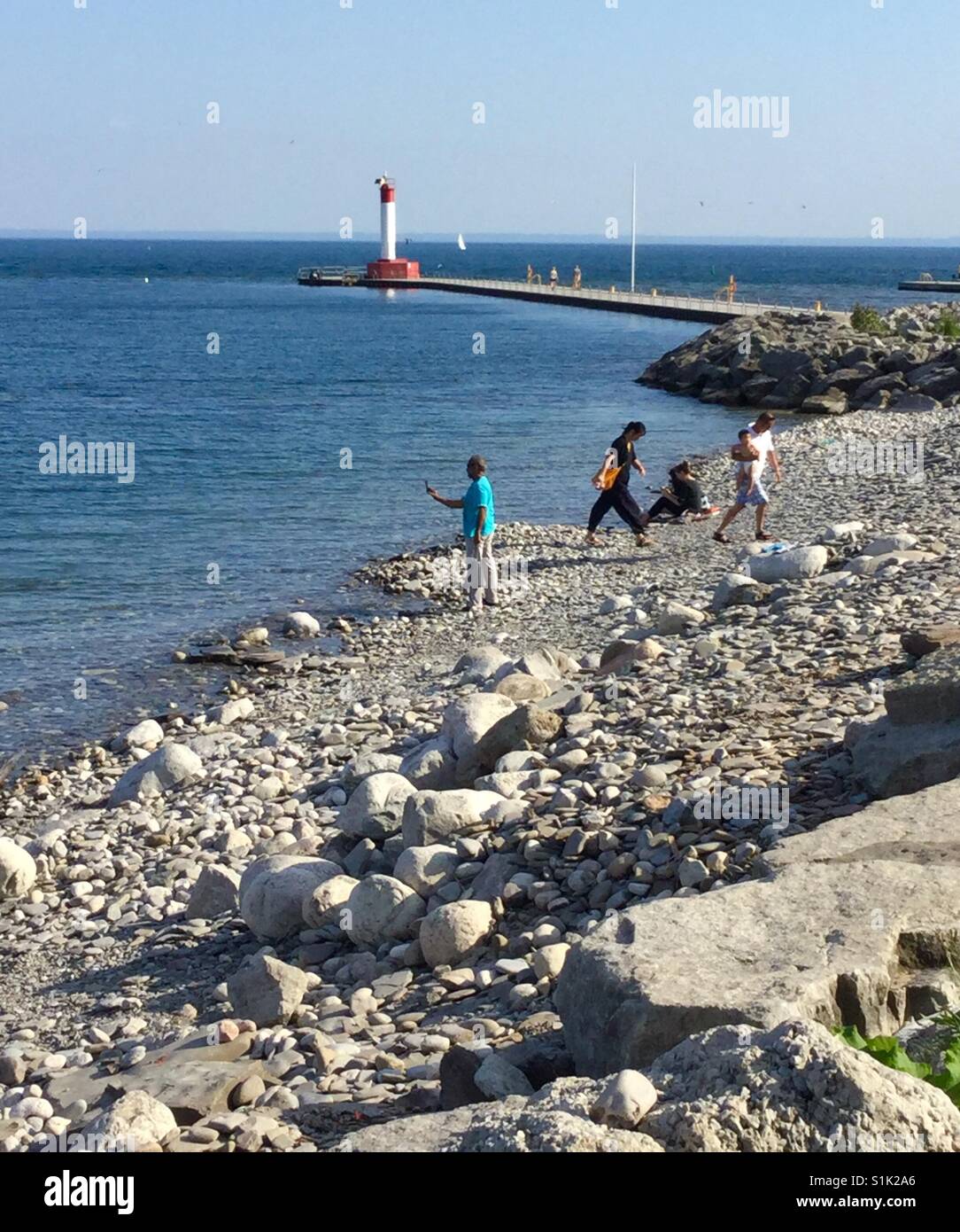 Rocky beach on the shores of Lake Ontario. - Smartphone Captured Stock Image