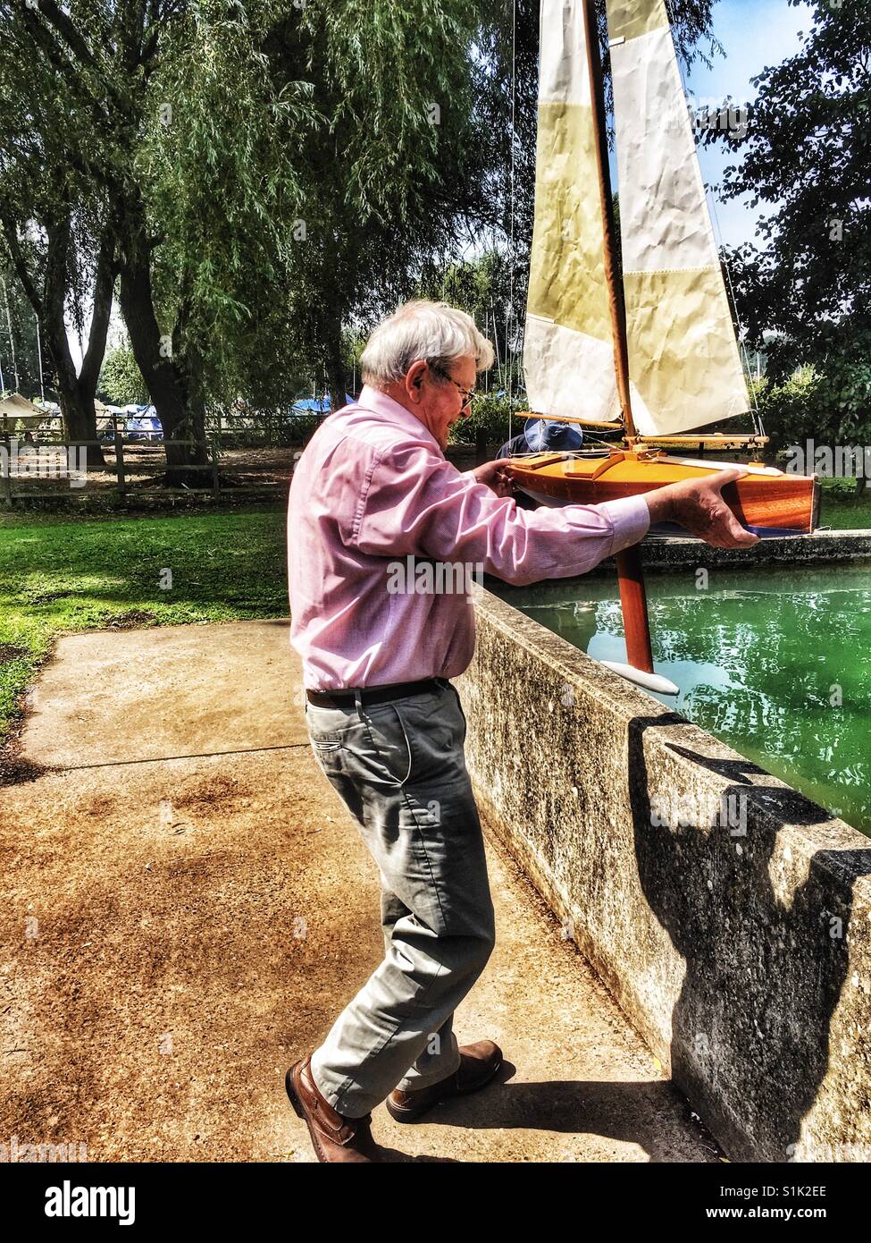 Model yacht enthusiast, Woodbridge, Suffolk, UK. - Smartphone Captured Stock Image