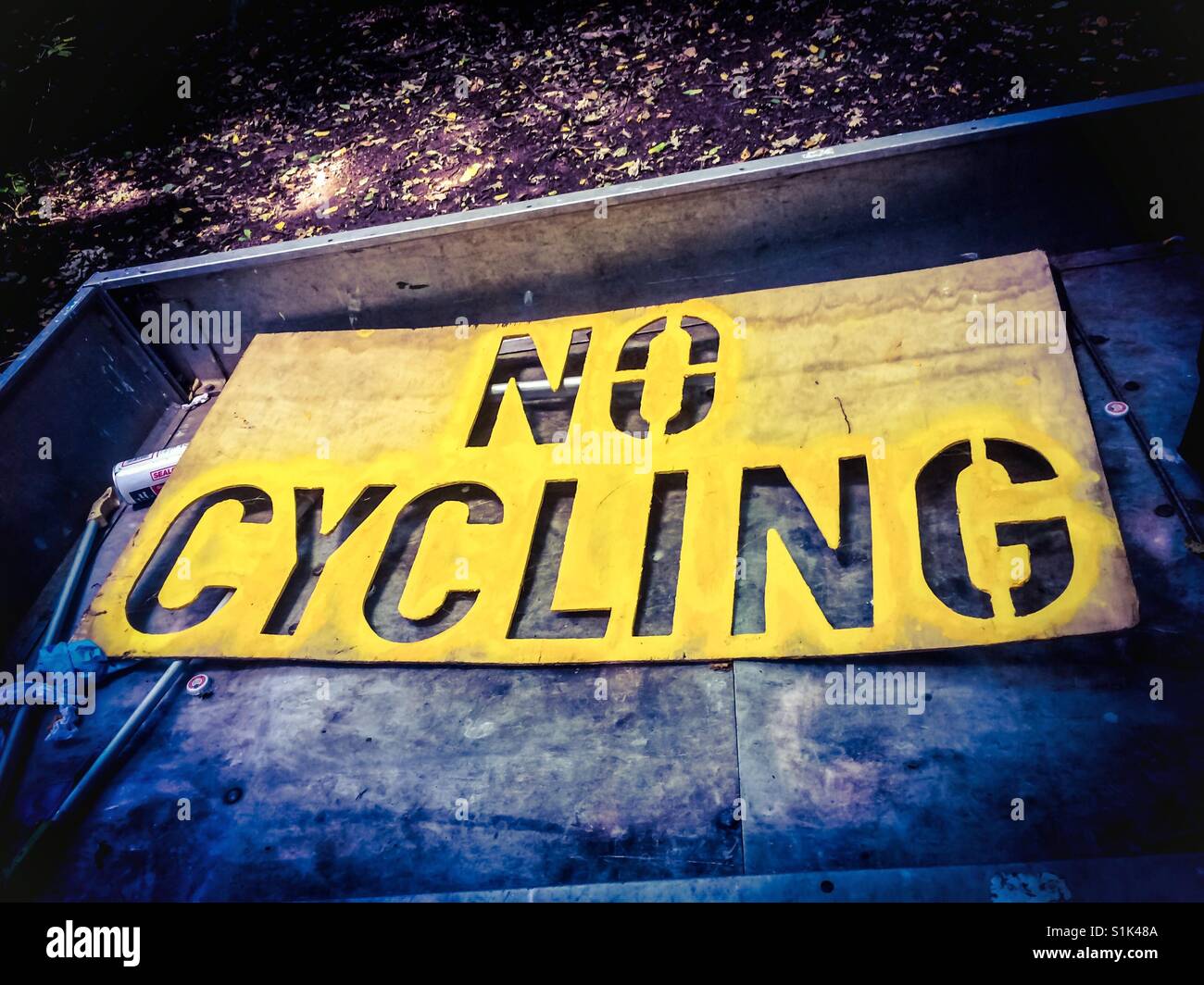 No Cycling stencil in the back of a truck - Smartphone Captured Stock Image