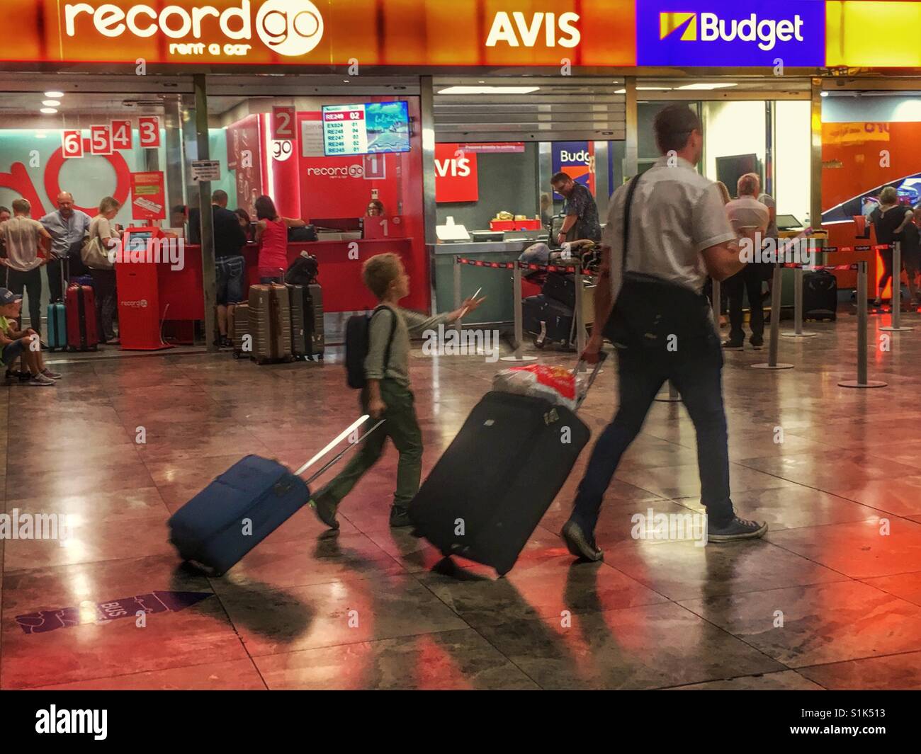 Car rental area and travellers at El Altet airport, Alicante ...