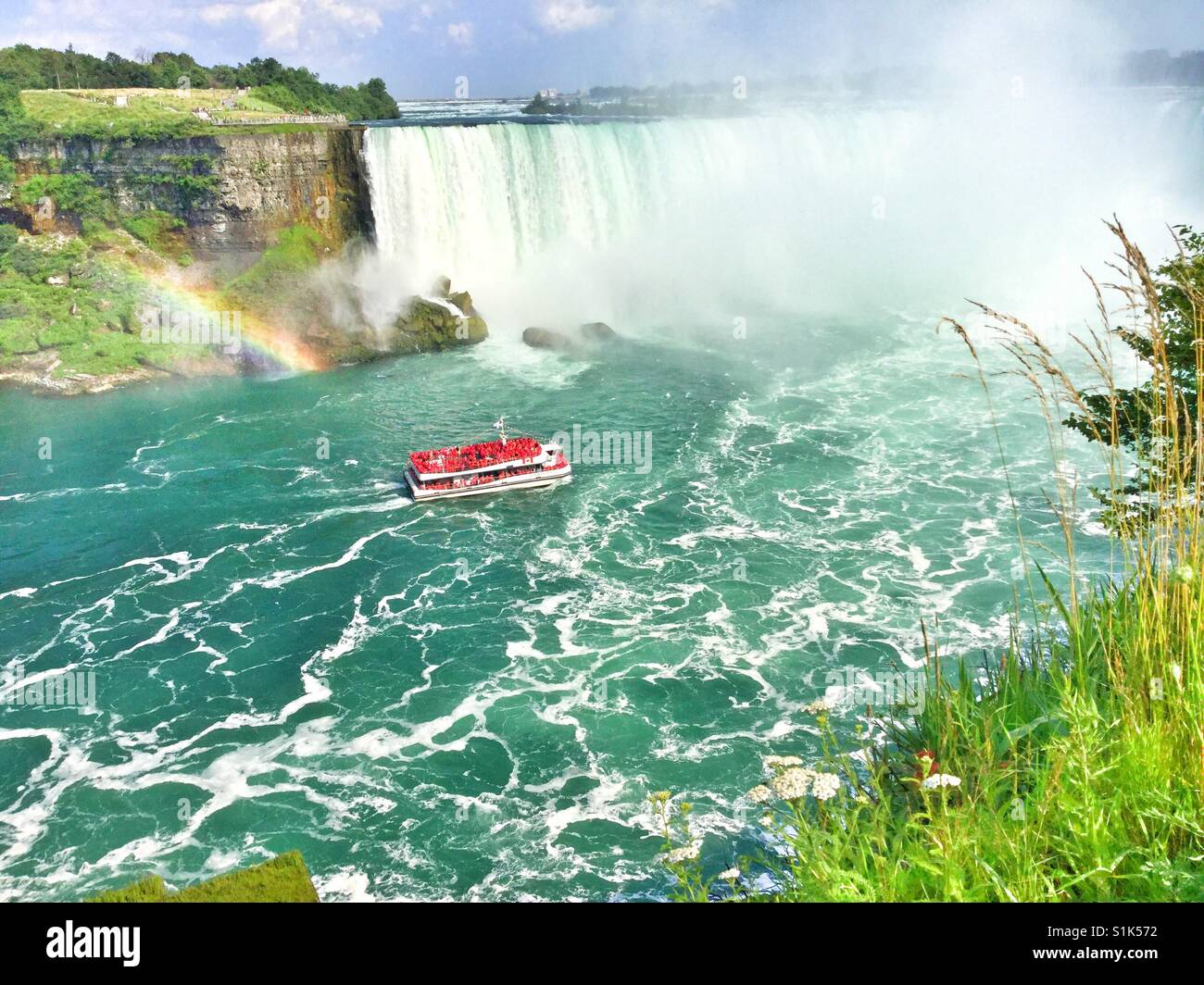 Rainbow at the Falls. - Smartphone Captured Stock Image