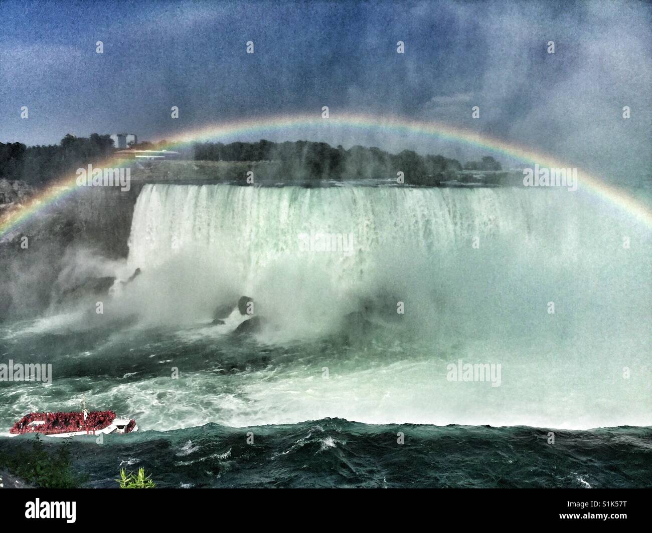 Looking down into the American Falls as a rainbow appears. - Smartphone Captured Stock Image