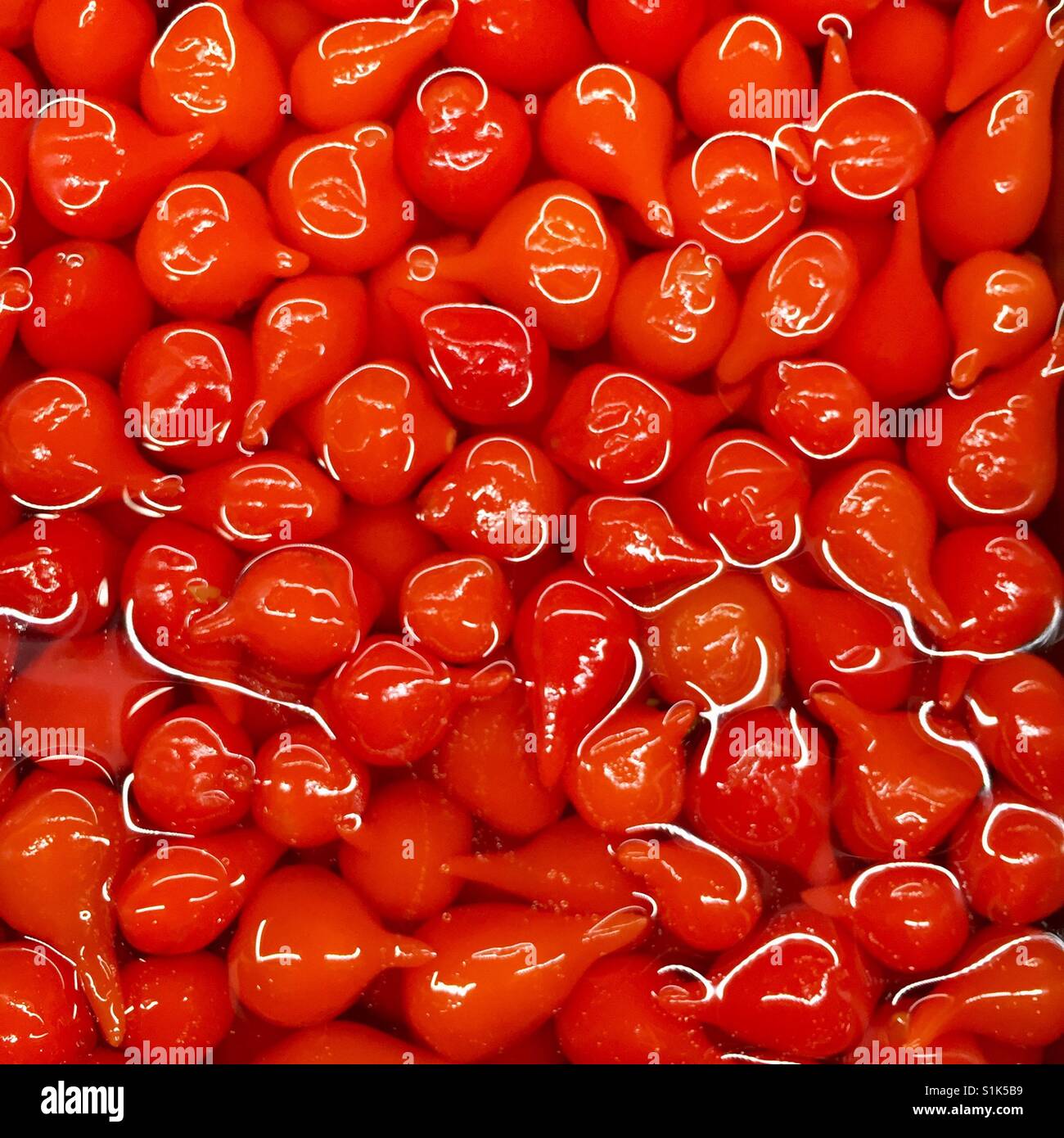 Tiny red peppers in an antipasto bar Stock Photo Alamy