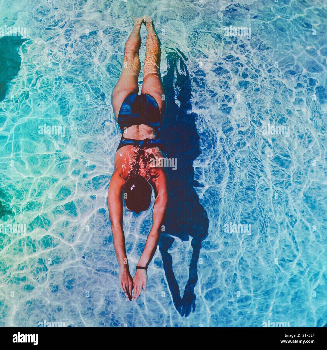 Woman swimming. Square crop. - Smartphone Captured Stock Image