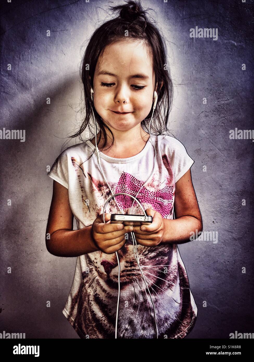 Child using a smartphone Stock Photo