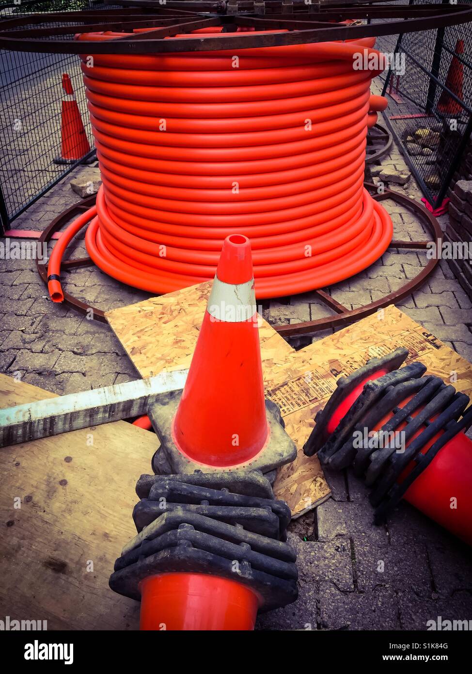 Laying conduit for fiber optic cable. Essential infrastructure for contemporary state-of-the-art communication technologies. Downtown, Ontario. - Smartphone Captured Stock Image