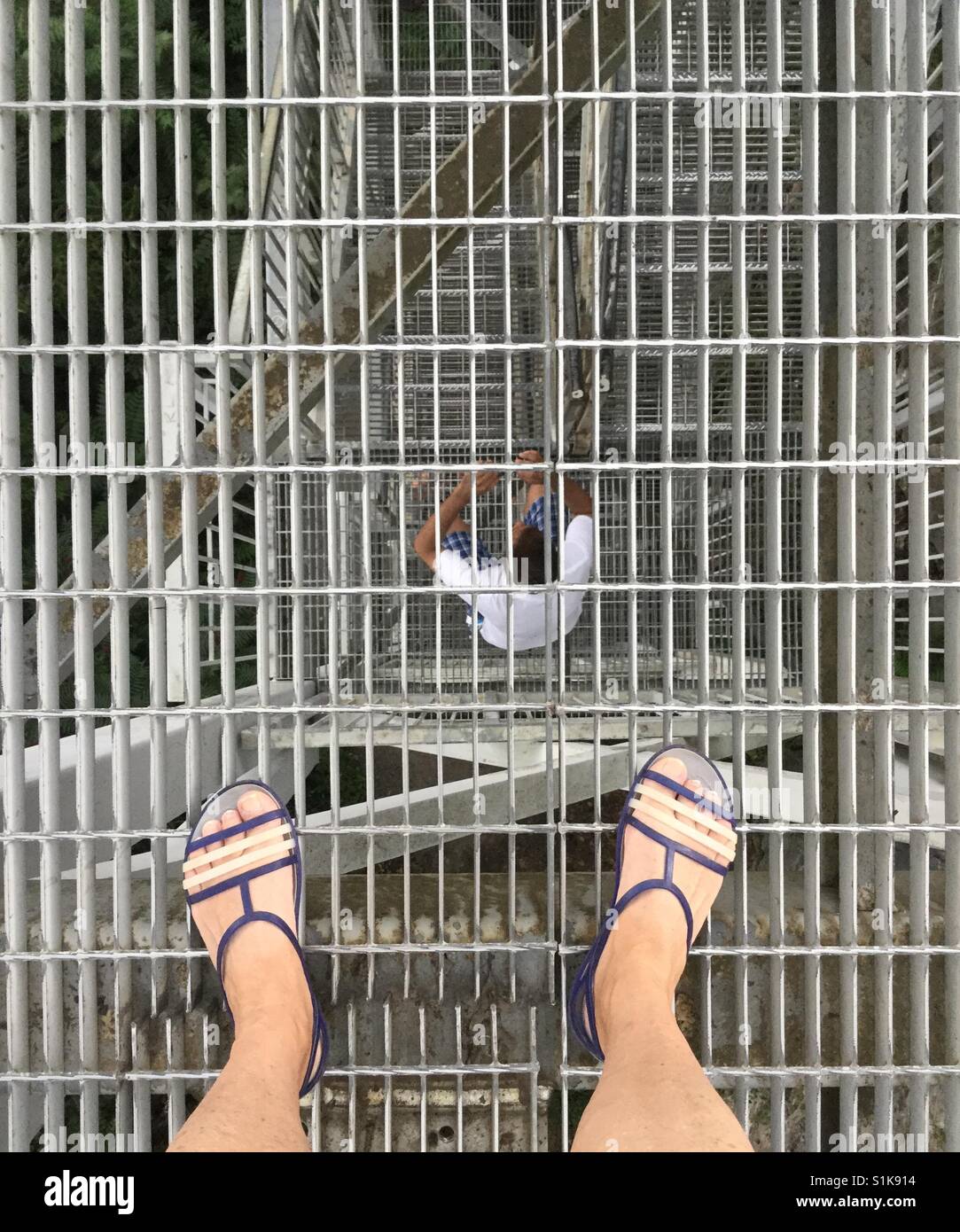 Looking through a metal staircase. - Smartphone Captured Stock Image