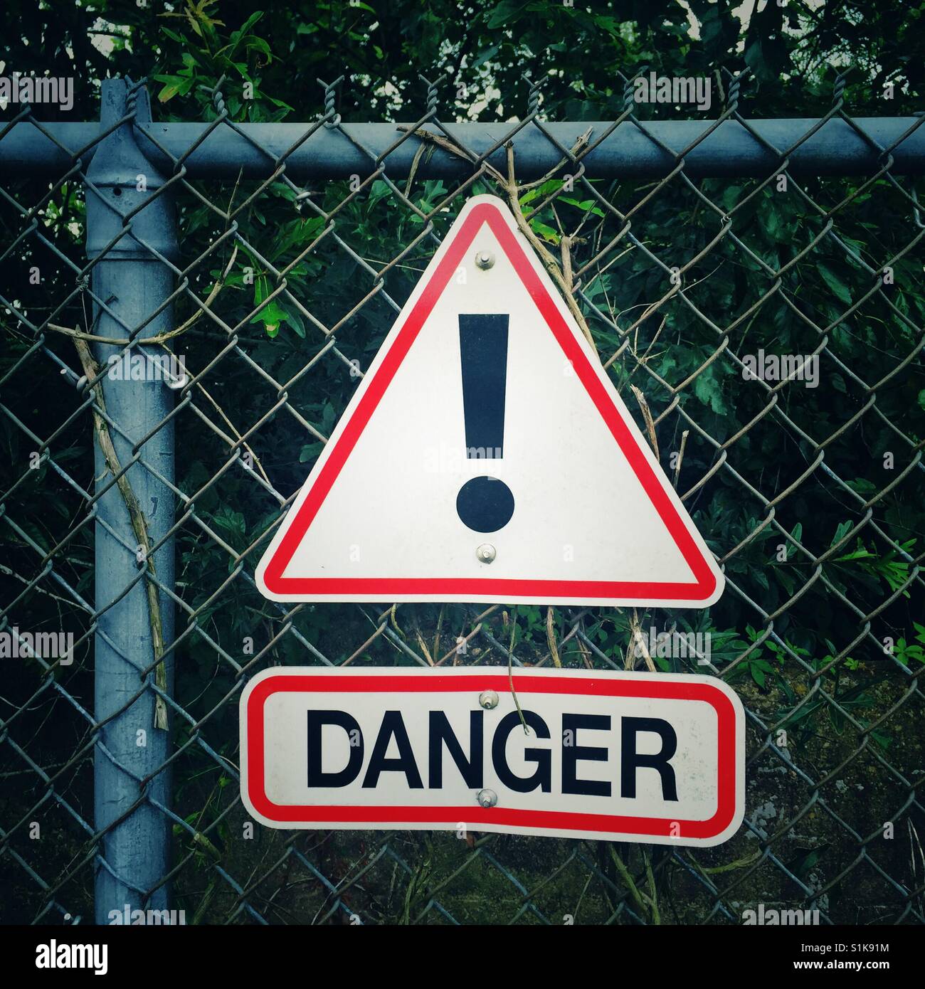 Sign DANGER on chainlink fence - Smartphone Captured Stock Image