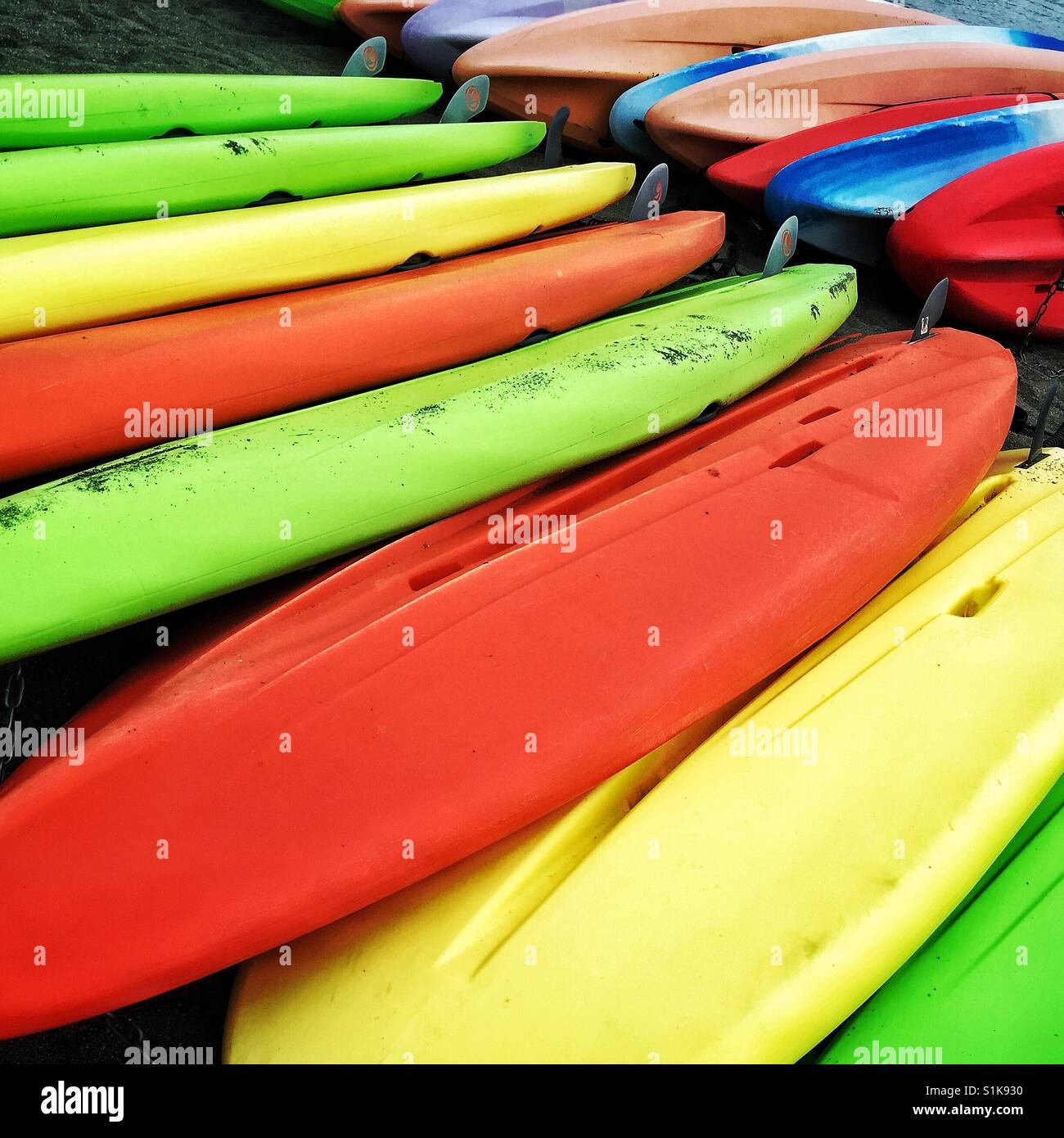 Colorful kayaks for rent on the beach - Smartphone Captured Stock Image