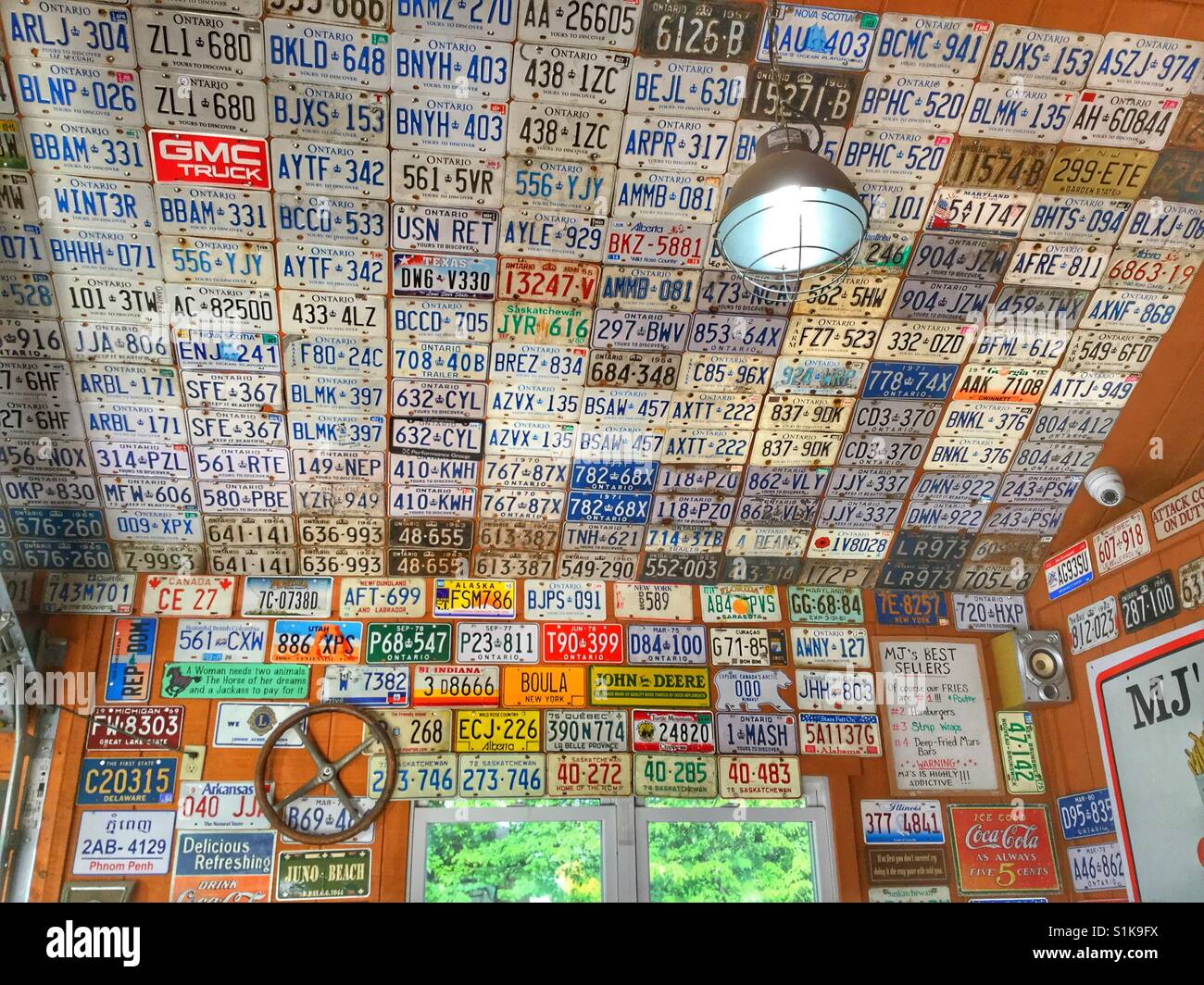 A wall of old license plates. - Smartphone Captured Stock Image