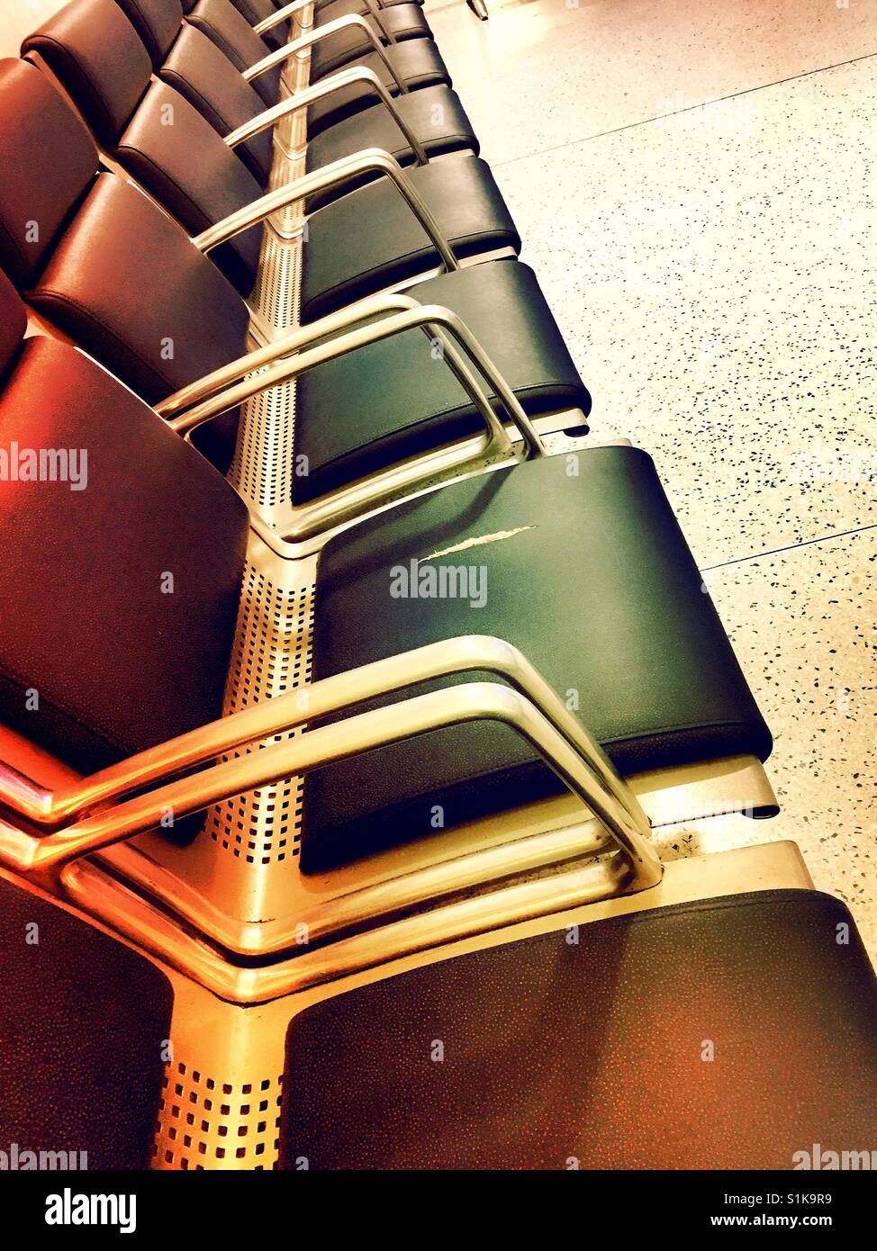 Row of chairs in public waiting room, USA - Smartphone Captured Stock Image