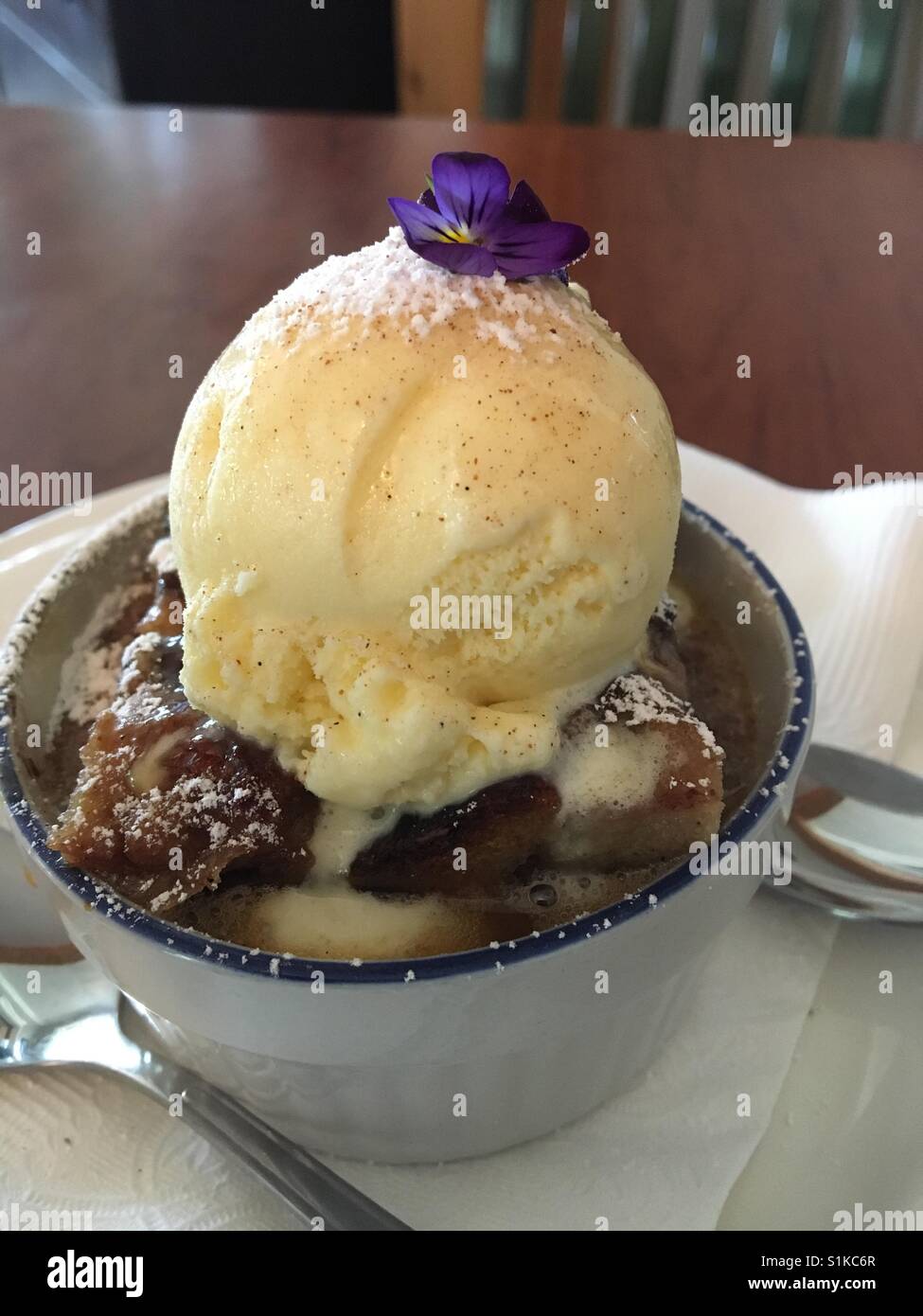 Bread pudding with vanilla ice cream Stock Photo Alamy