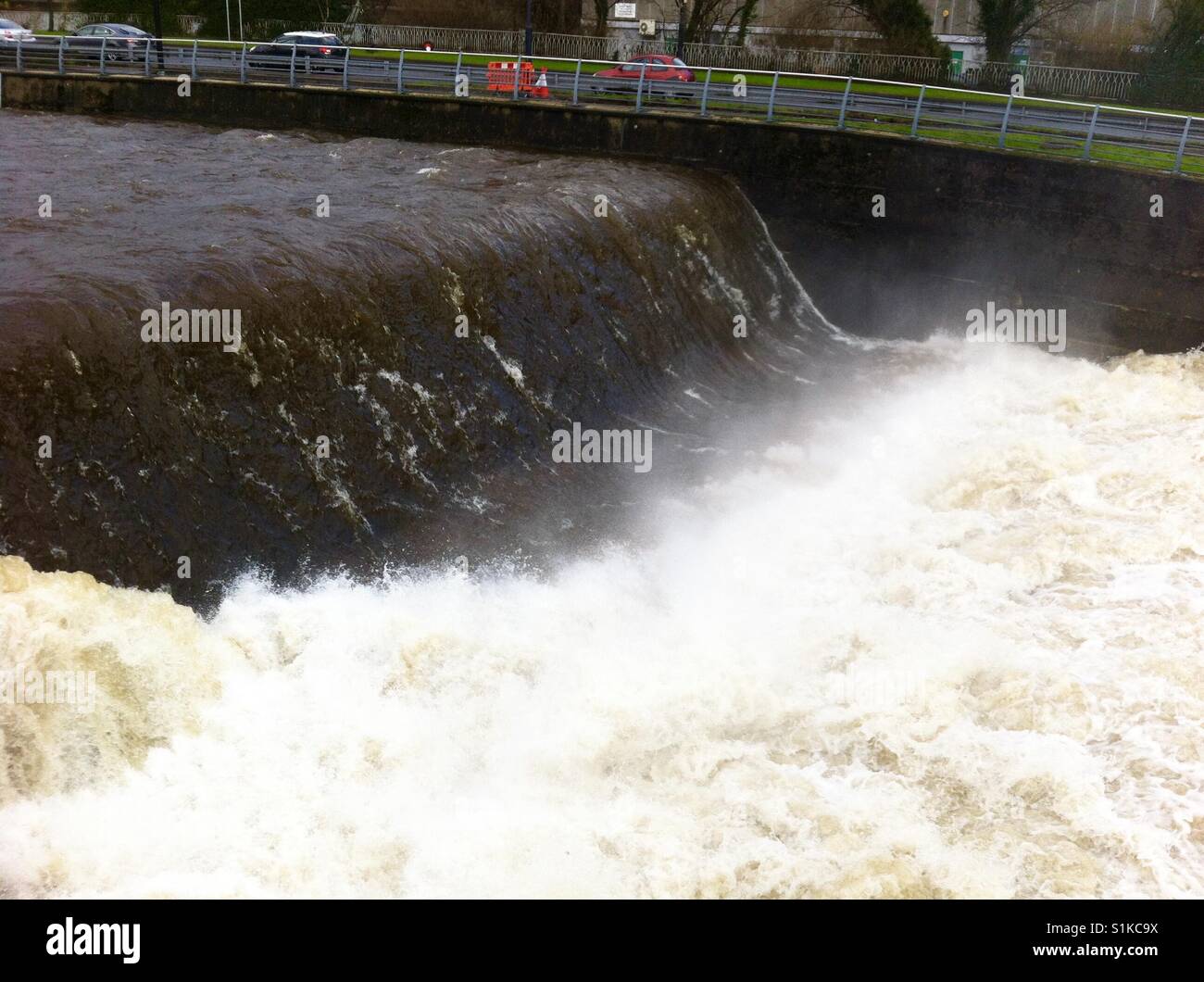 River Taff in flood at the weir in Merthyr Tydfil, South Wales, after heavy rain - Smartphone Captured Stock Image