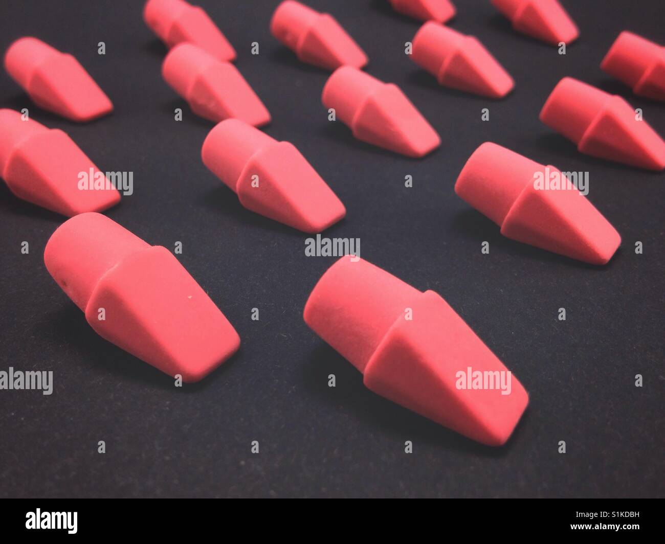 Pattern with red erasers. Education concept. - Smartphone Captured Stock Image