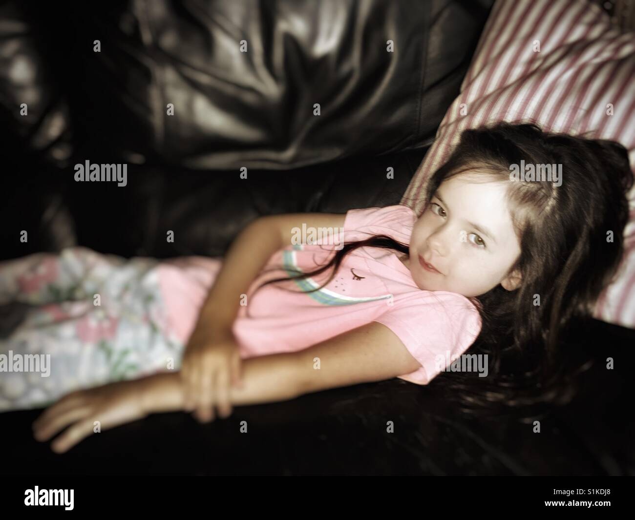 Child relaxing on the sofa - Smartphone Captured Stock Image