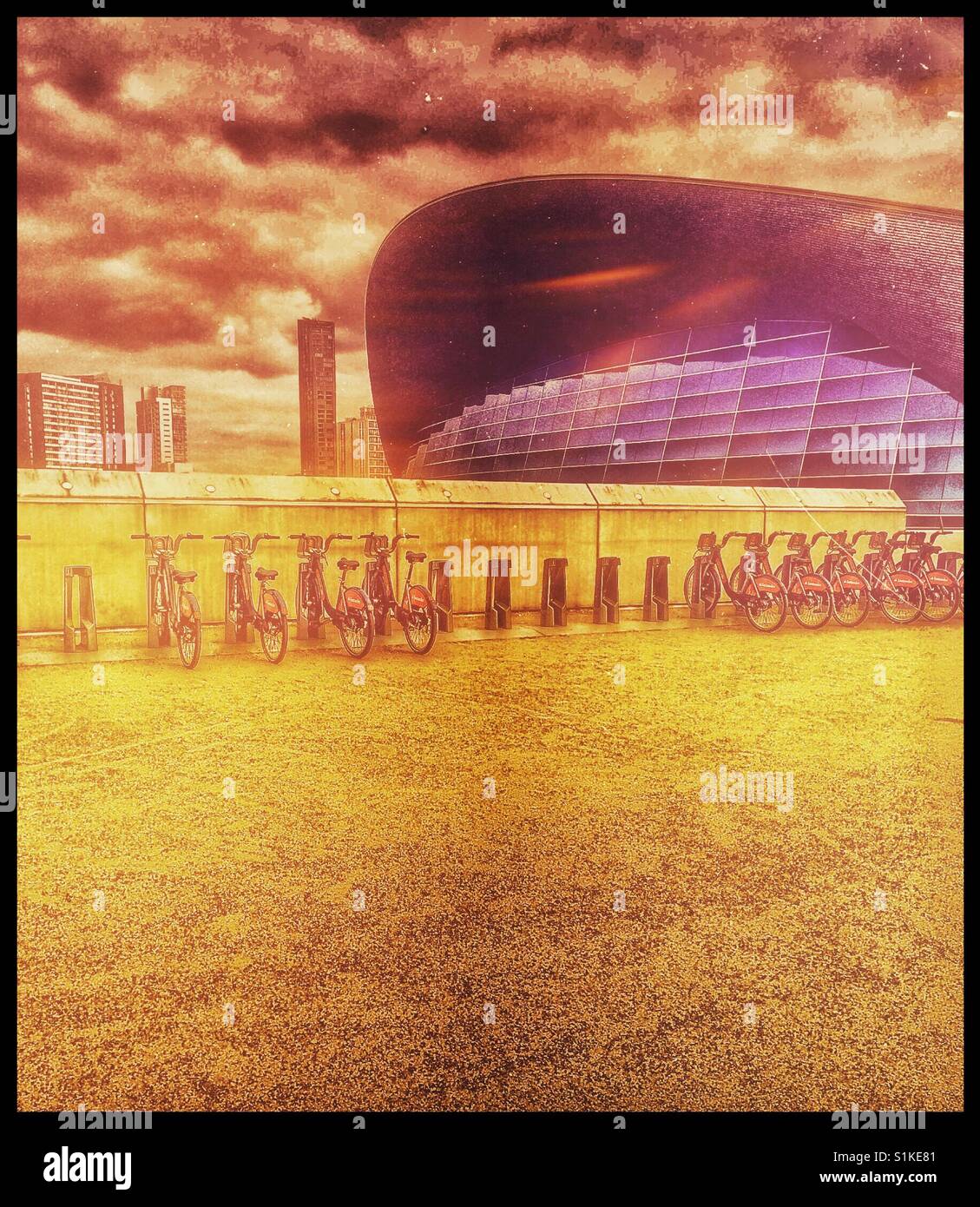 Rental bikes docking station and Olympic aquatic centre, London - Smartphone Captured Stock Image