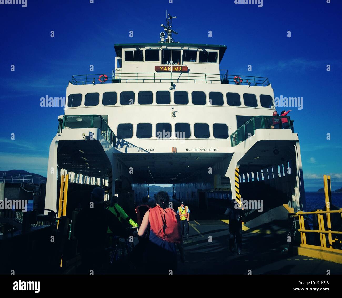 People walking on the Washington state ferry  on Lopez island - Smartphone Captured Stock Image