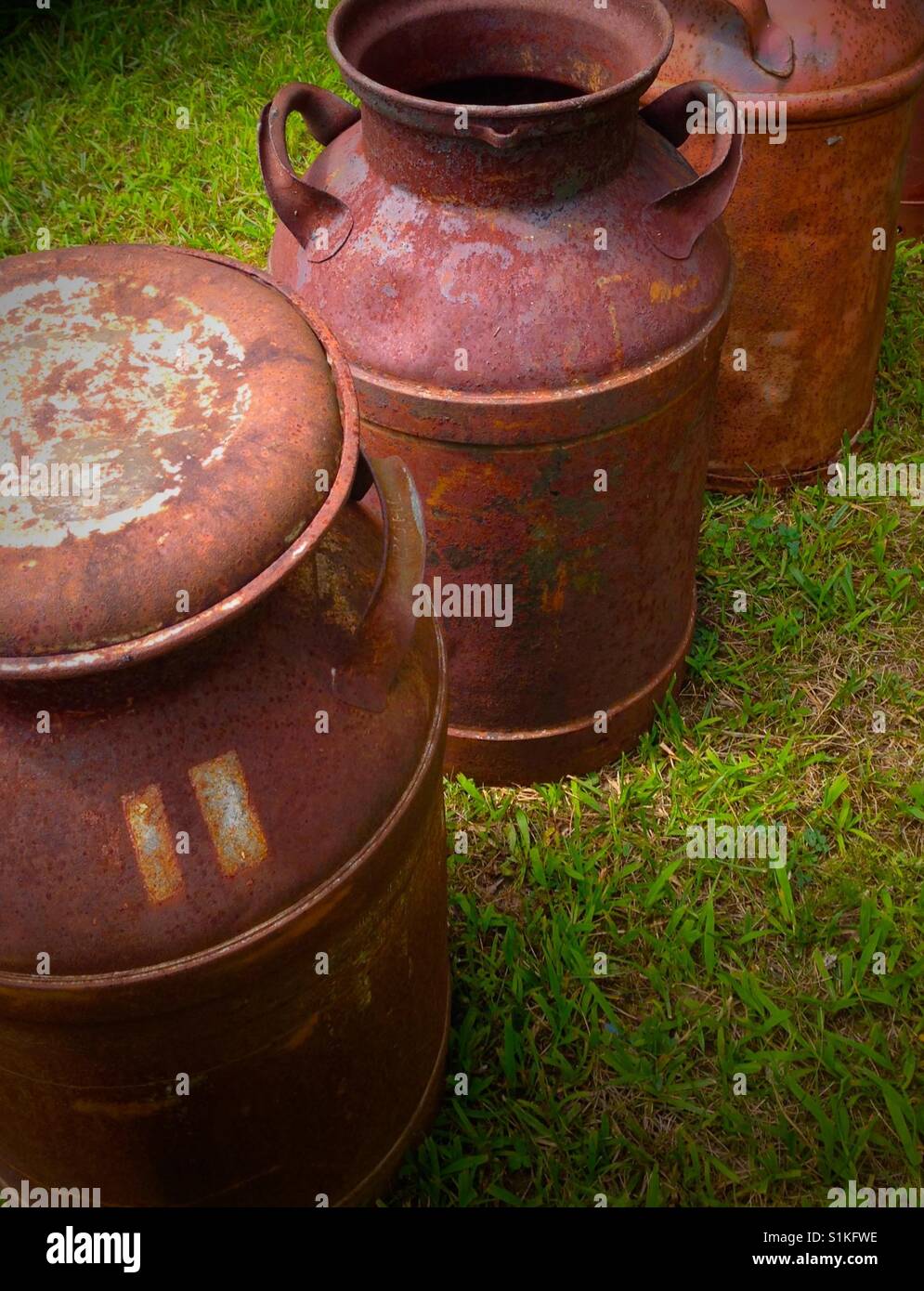 A Large Multi Color Metal Milk Container, Taken On A Sunny Day Stock Photo,  Picture and Royalty Free Image. Image 18682827.