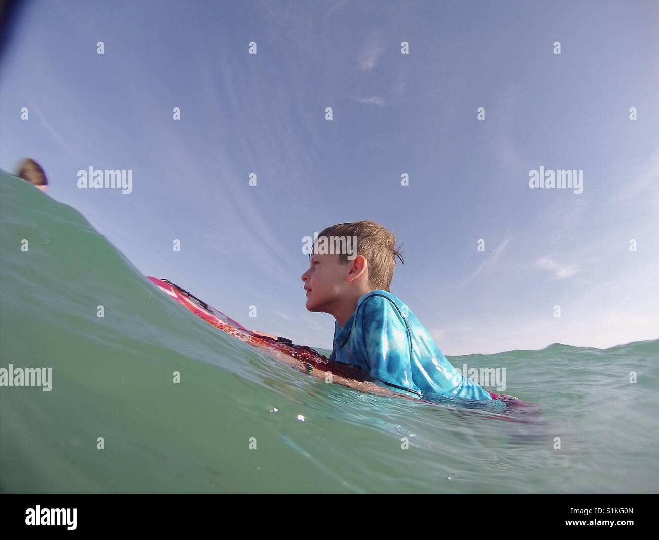 Young boy surfing Stock Photo