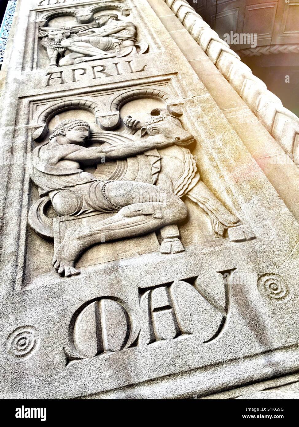 Astrology sign for the month of May, Taurus, on the building entrance artwork, NYC, USA. - Smartphone Captured Stock Image