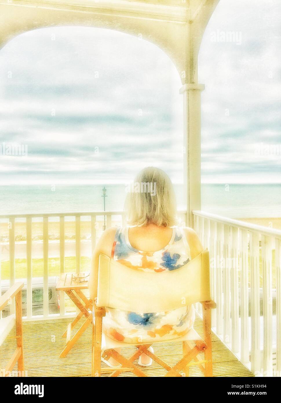 A woman gazing out to sea. - Smartphone Captured Stock Image