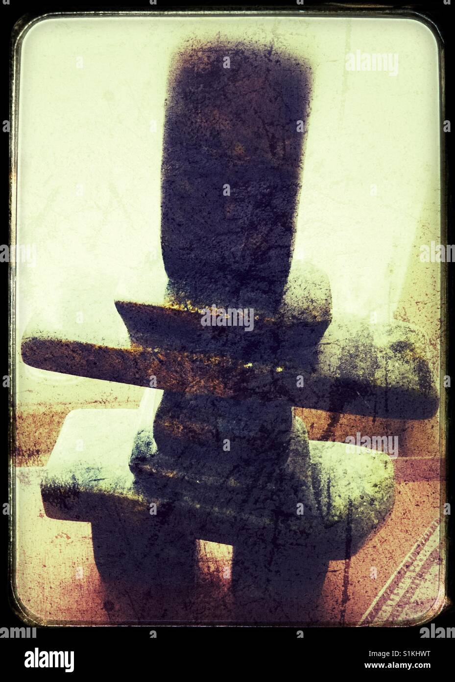 An Inukshuk carved out of stone. - Smartphone Captured Stock Image