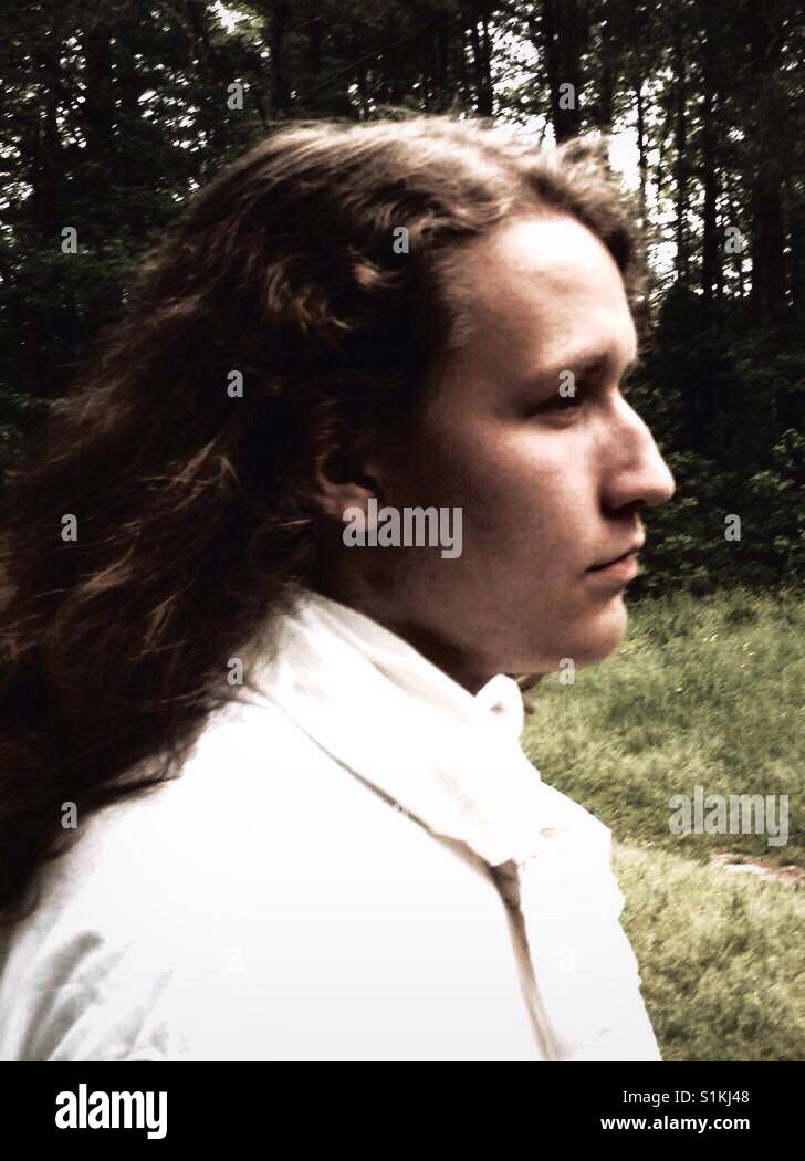 North Carolinian Gothic- young man stoically faces west (or maybe south) - Smartphone Captured Stock Image