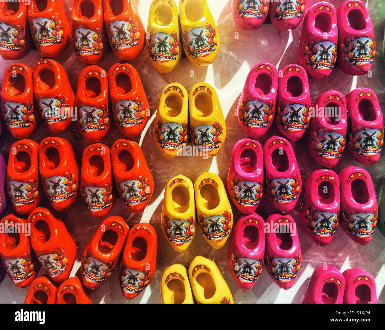 Miniature fridge magnets clog shoes on display at Schilpol international airport in Amsterdam Stock Photo