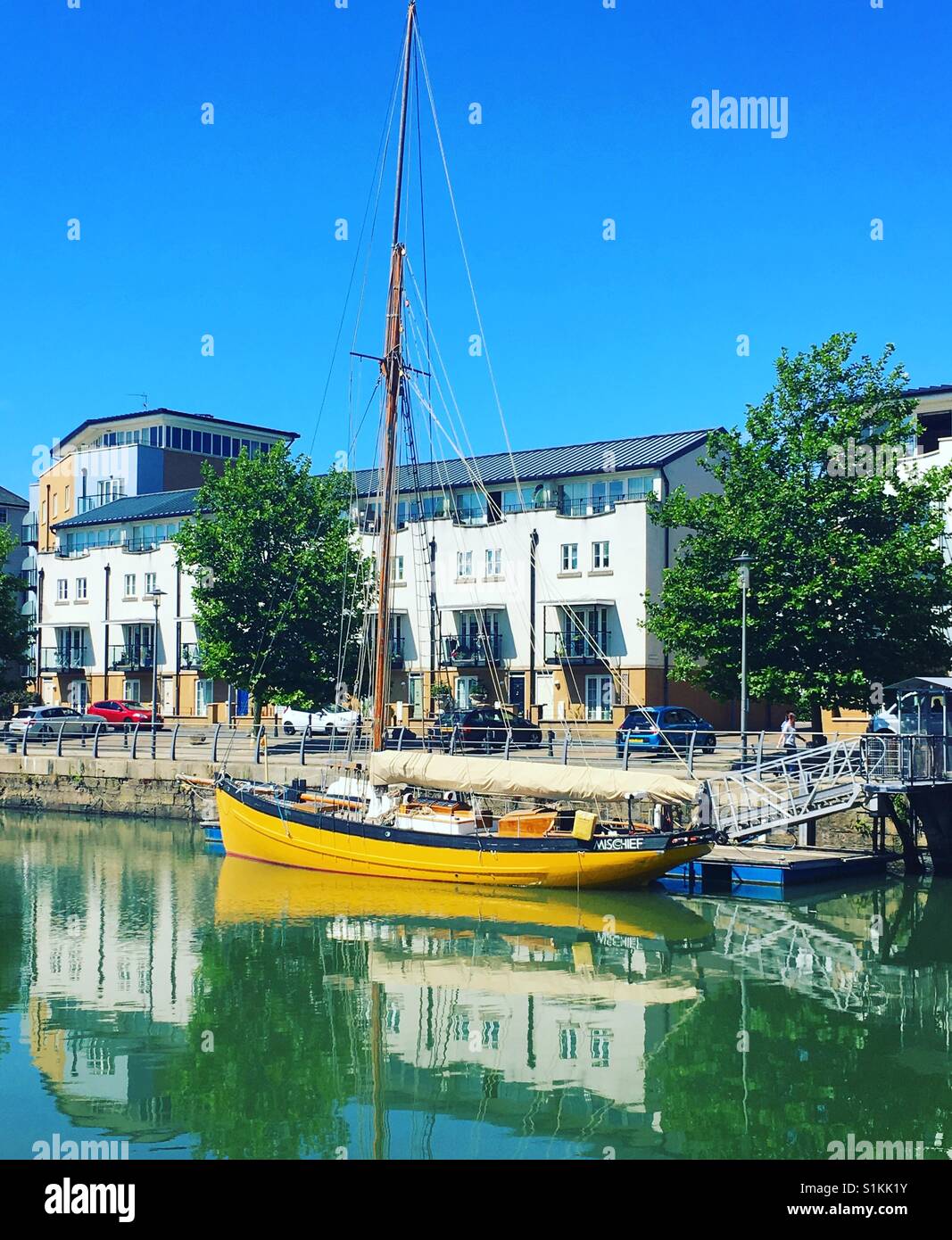 Yellow sail boat at Portishead's Marina Quays Stock Photo Alamy