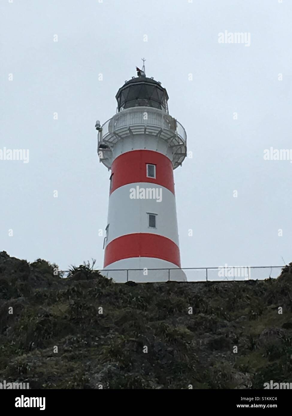 Cape Palliser Lighthouse, on the Southern tip of North Island, New Zealand. Stock Photo