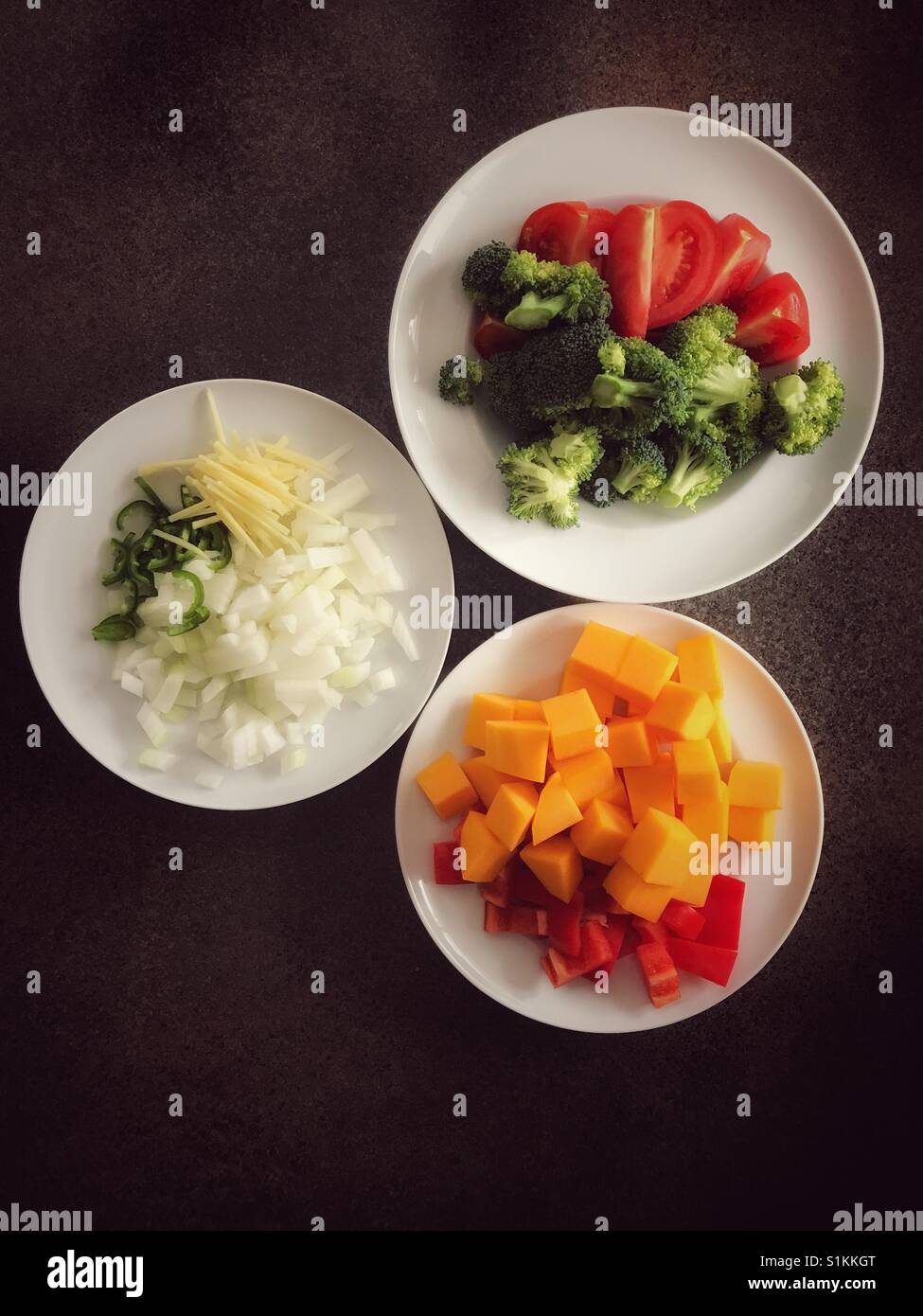 Plates of healthy vegetables, prepared and ready for cooking. Stock Photo