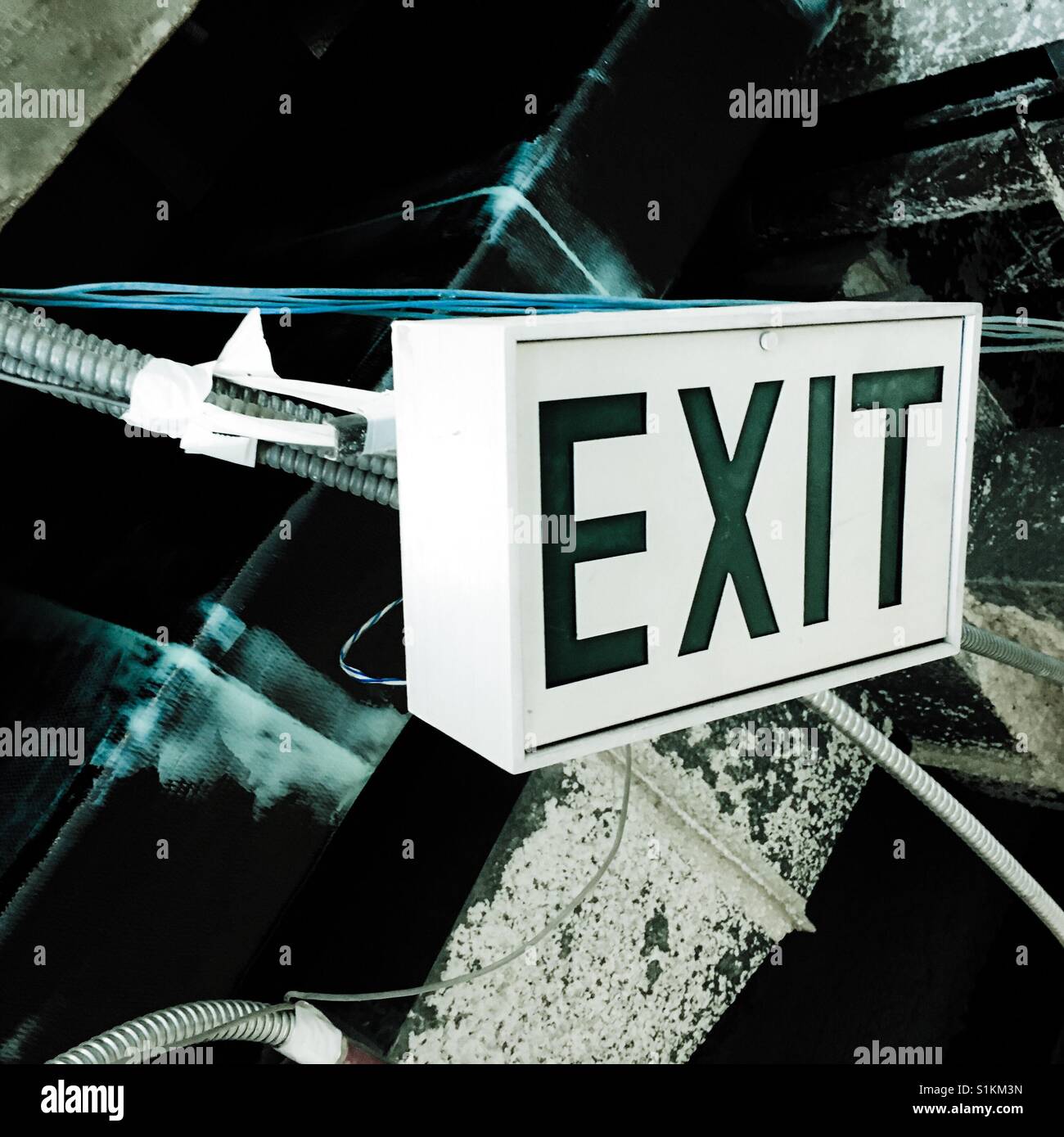 Exit sign in construction site hanging Stock Photo Alamy