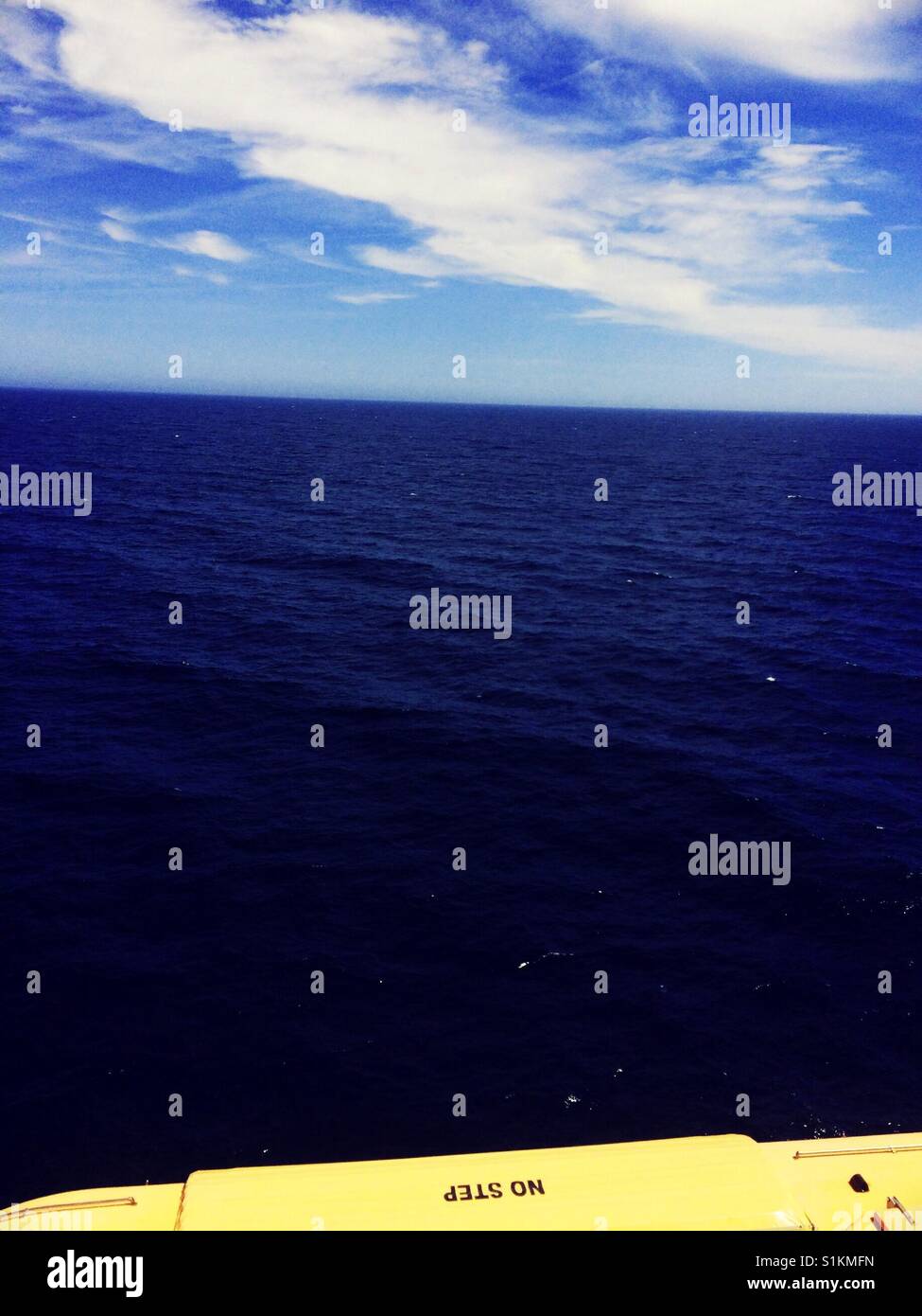 No step written on underside of lifeboat on ship at sea - Smartphone Captured Stock Image