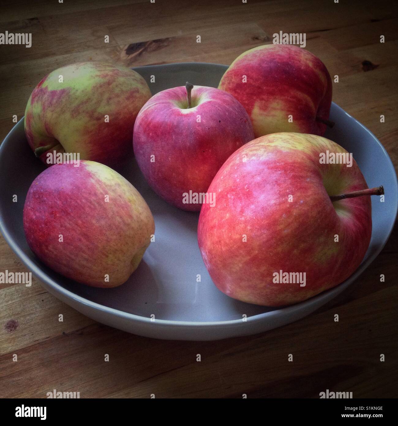 Bowl of apples off of the backyard tree Stock Photo