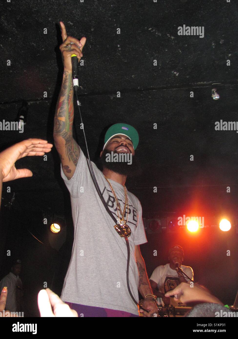 Stalley live on stage with fans and DJ Stock Photo