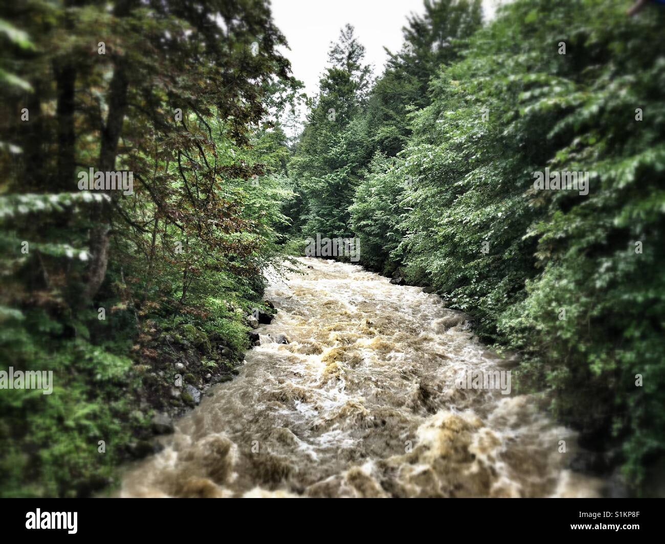 Strong current in the river Breitach which has swolen during Heavy Summer rainfalls Stock Photo