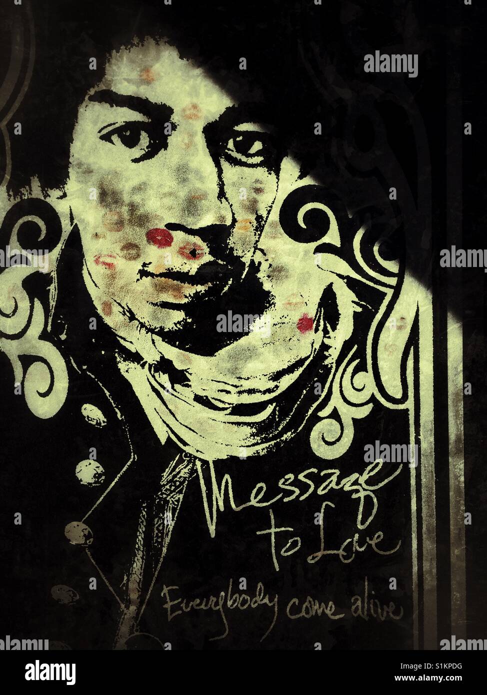 Lipstick kisses cover memorial marble relief on Jimmy Hendrix grave - Smartphone Captured Stock Image