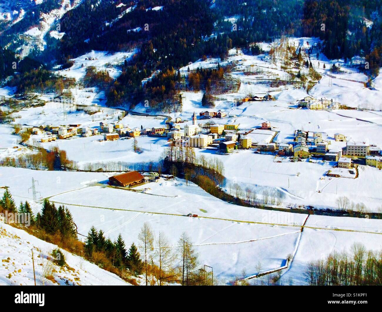 Swiss village nestled in a valley in the alps Stock Photo - Alamy