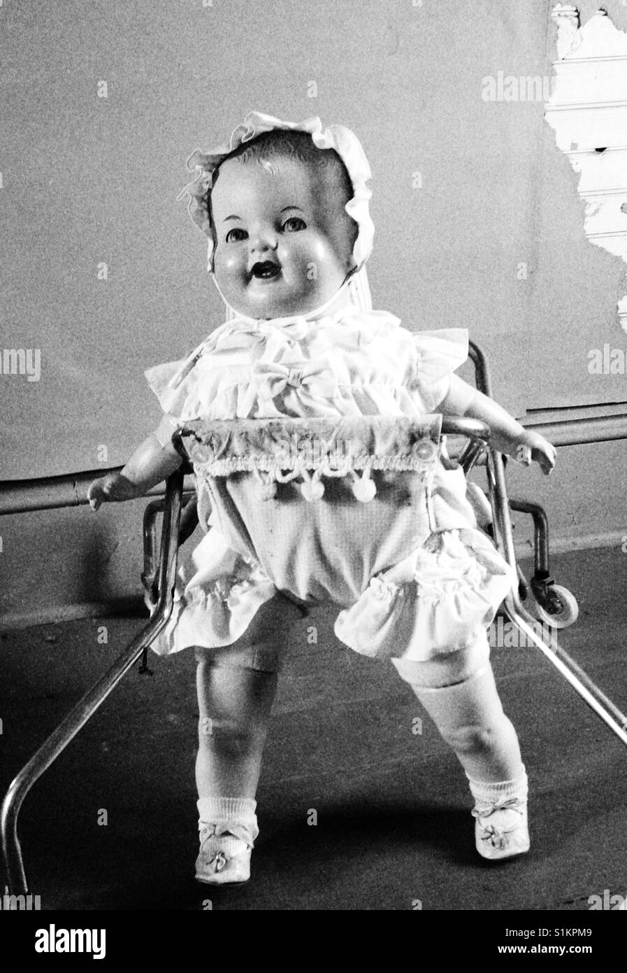 Black and white of Doris, composition doll in vintage walker - Smartphone Captured Stock Image