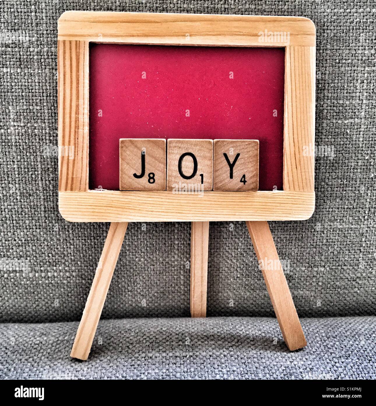 Miniature chalkboard spelling Joy. - Smartphone Captured Stock Image