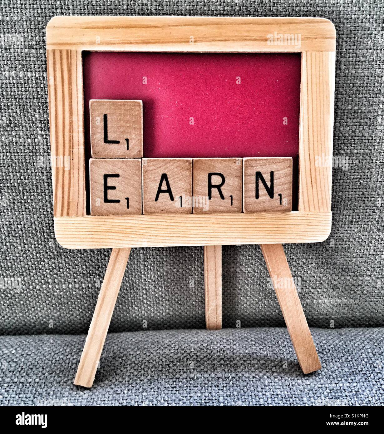 Miniature chalkboard spelling Learn. - Smartphone Captured Stock Image
