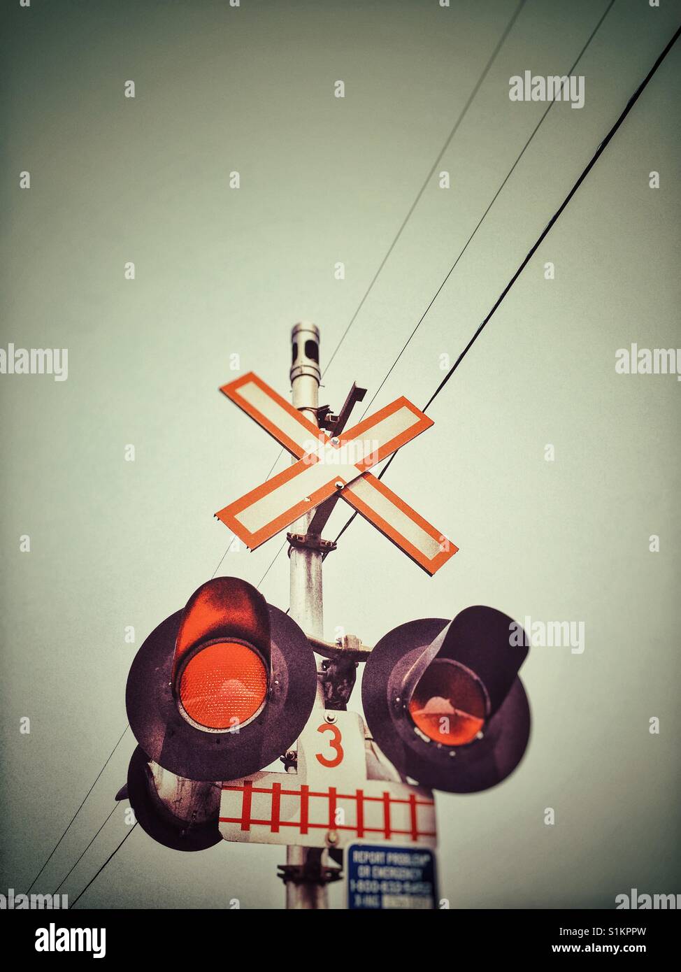 Flashing rail crossing lights, British Columbia, Canada. - Smartphone Captured Stock Image