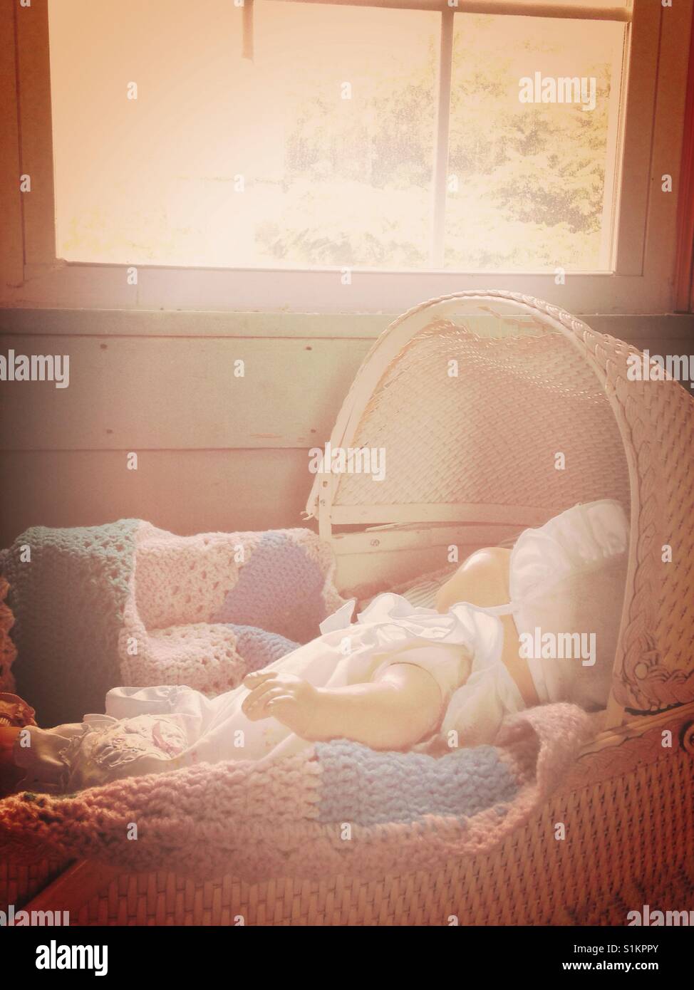 Sleeping baby doll- Doris the vintage composition doll sleeps in antique bassinet - Smartphone Captured Stock Image